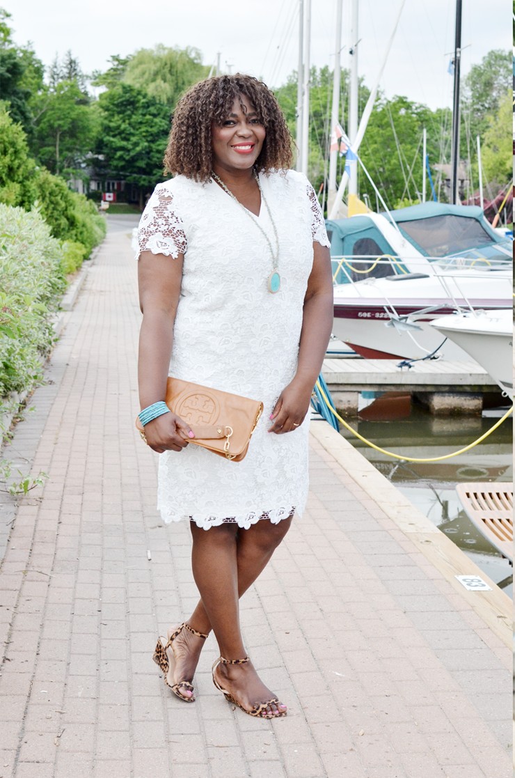  A stunning white plus size lace dress fit for a bride or all white party. With short sleeves and midi length.
