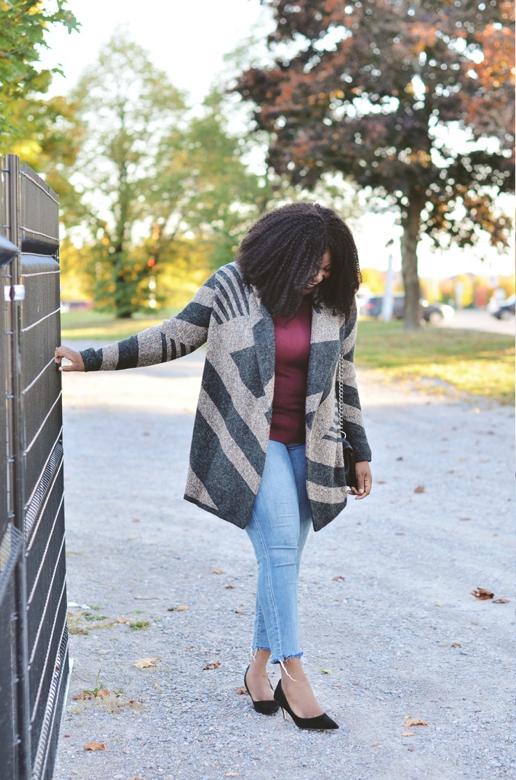 Raw denim jeans womens- Assa-cisse wearing a cozy coatigan perfect for fall.